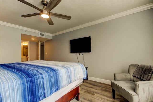 bedroom featuring crown molding, ceiling fan, and hardwood / wood-style floors