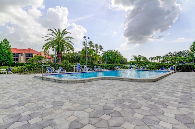 view of swimming pool featuring a patio area