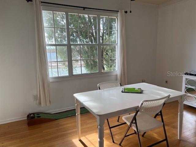 501 Knights Run Ave Unit 2119, Tampa, FL 33602 - dining space with plenty of natural light and wood finished floors