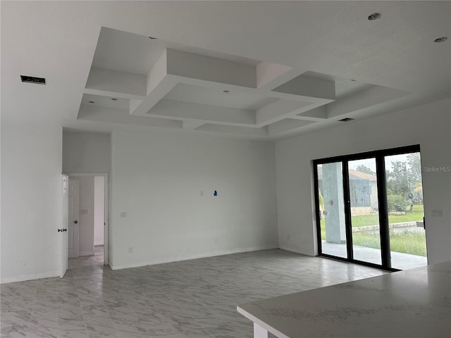 unfurnished room with a towering ceiling