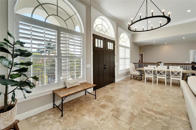 entryway featuring crown molding