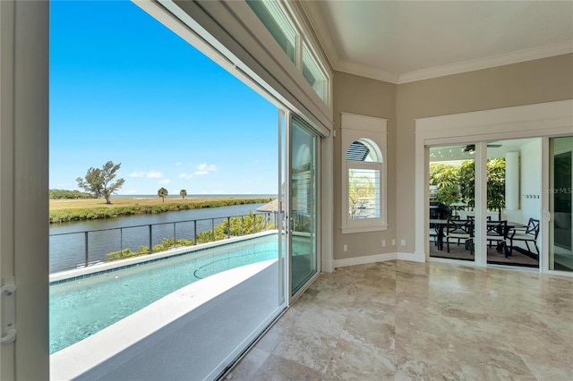 interior space with crown molding and a water view