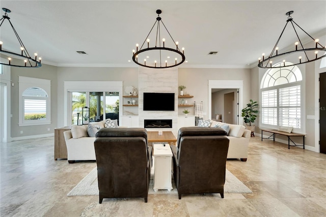 living room with a fireplace, plenty of natural light, and ornamental molding