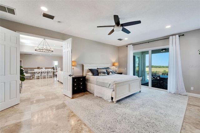 bedroom featuring ceiling fan with notable chandelier and access to outside