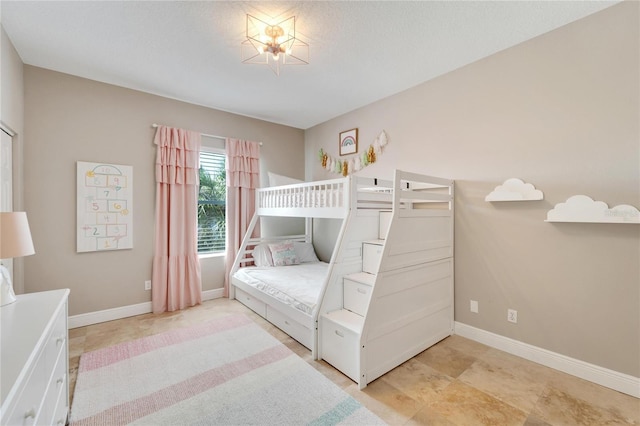 bedroom featuring a chandelier