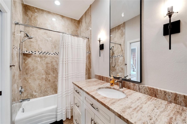 bathroom with vanity and shower / tub combo