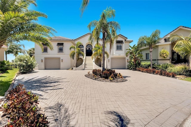 mediterranean / spanish house featuring a garage