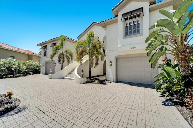 mediterranean / spanish house featuring a garage