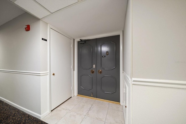 foyer entrance featuring light tile patterned floors