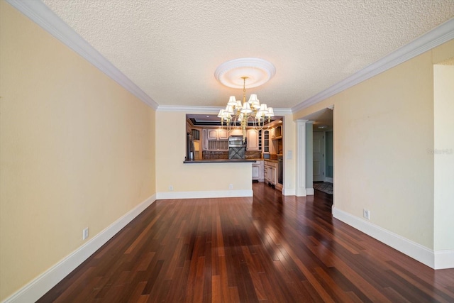 unfurnished dining area with an inviting chandelier, dark hardwood / wood-style floors, crown molding, and a textured ceiling