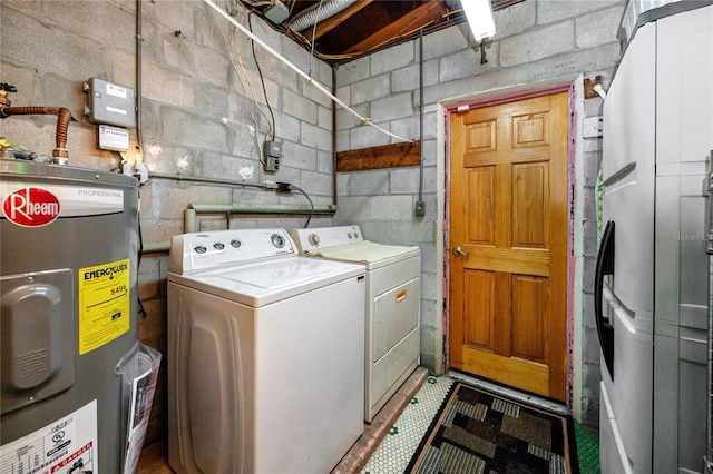 washroom with electric water heater and washer and clothes dryer