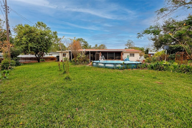 view of yard with an outdoor pool