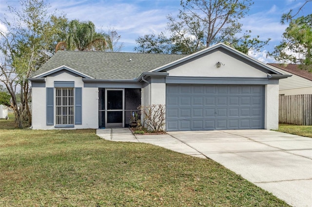 ranch-style home with a garage and a front lawn