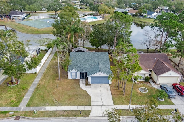 birds eye view of property featuring a water view