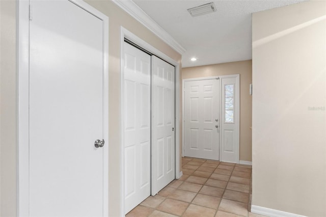 foyer with light tile patterned flooring