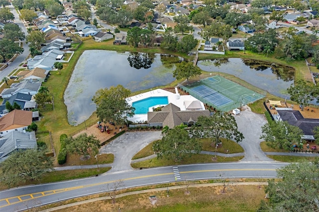 birds eye view of property with a water view