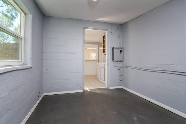 spare room featuring concrete flooring