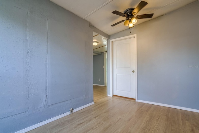 spare room featuring ceiling fan and light hardwood / wood-style flooring