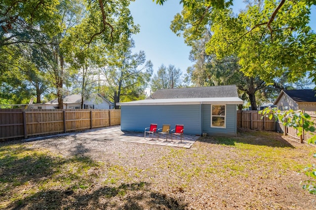 back of house with a patio