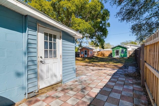 view of patio with a storage unit