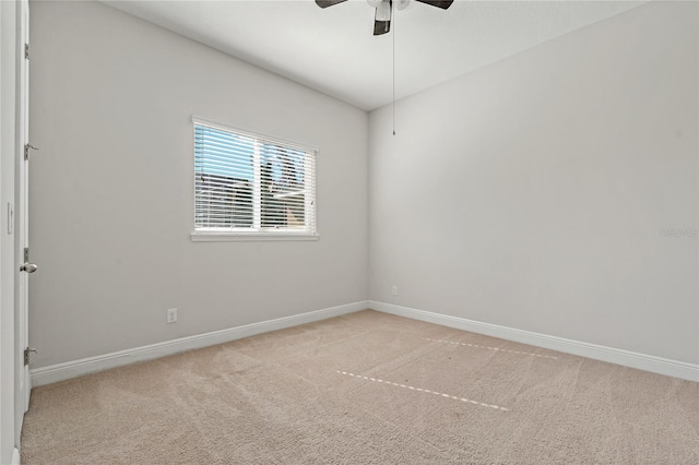 empty room with light colored carpet and ceiling fan