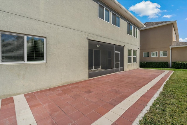 back of house featuring a yard and a patio area