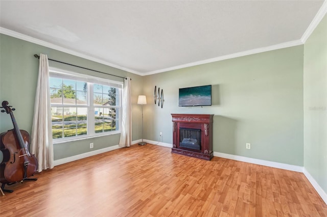 unfurnished living room with ornamental molding and light wood-type flooring