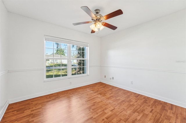 unfurnished room with wood-type flooring and ceiling fan