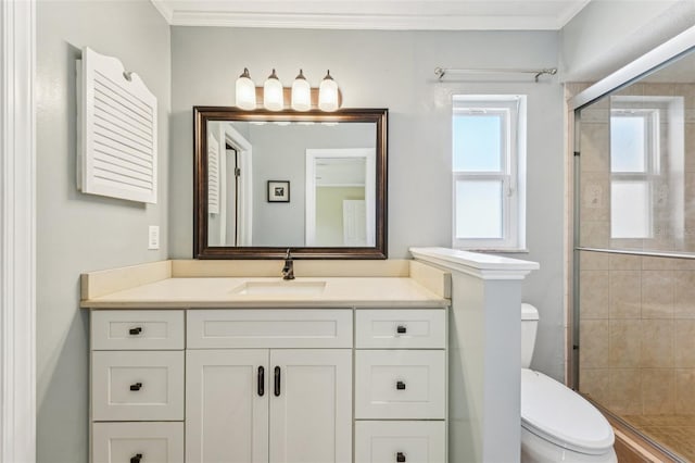 bathroom featuring walk in shower, ornamental molding, toilet, and vanity