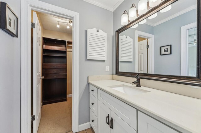 bathroom with vanity and ornamental molding