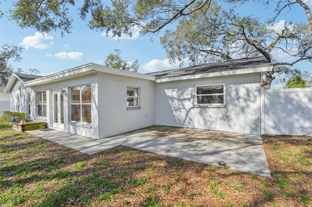 view of side of home featuring a patio