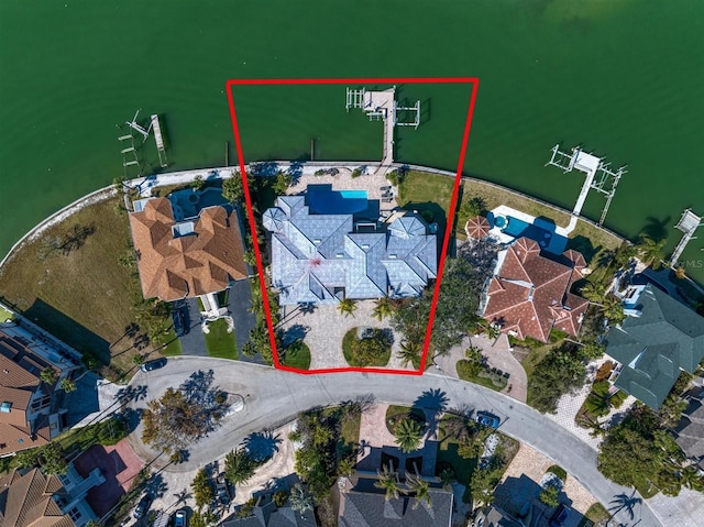 birds eye view of property with a water view