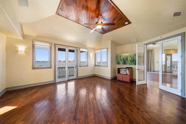 unfurnished living room featuring hardwood / wood-style flooring, wood ceiling, ceiling fan, baseboards, and visible vents