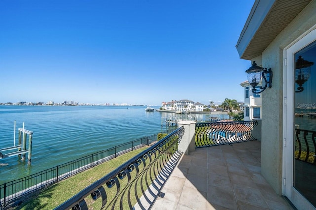 balcony featuring a water view