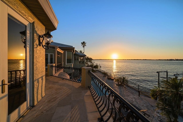 balcony featuring a water view