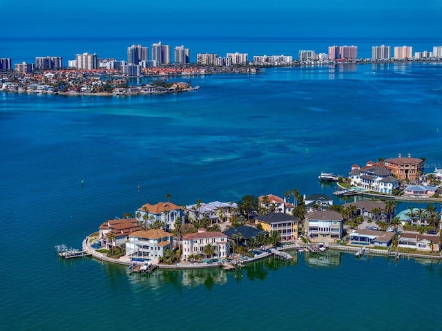 drone / aerial view with a city view and a water view