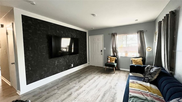 living area with hardwood / wood-style flooring