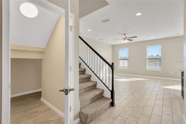 stairs with ceiling fan