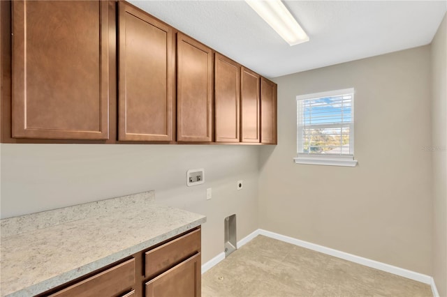 laundry room featuring cabinets, hookup for a washing machine, and electric dryer hookup