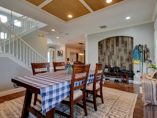 dining space featuring wood ceiling, crown molding, and dark wood-type flooring