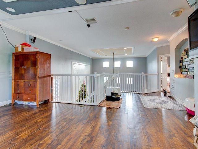 interior space featuring ornamental molding and dark hardwood / wood-style floors