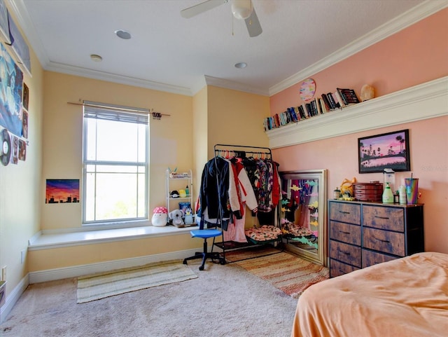 carpeted bedroom featuring ceiling fan and ornamental molding