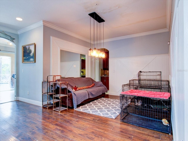 bedroom featuring crown molding and hardwood / wood-style floors