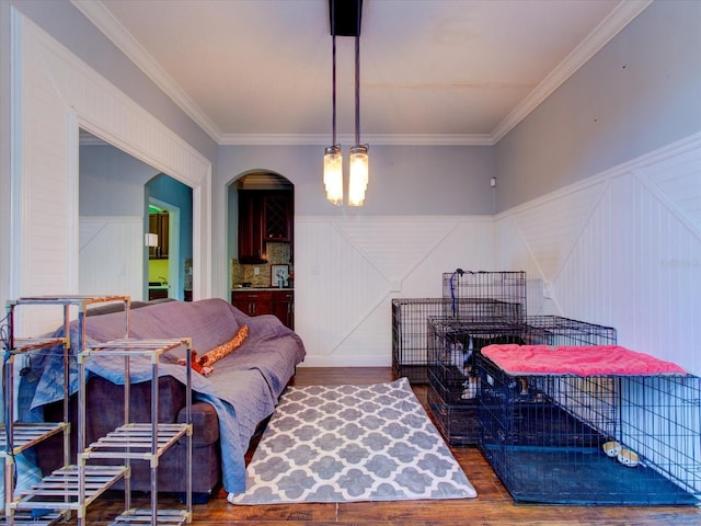 living room with hardwood / wood-style floors and ornamental molding