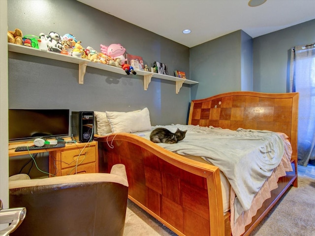 carpeted bedroom featuring built in desk