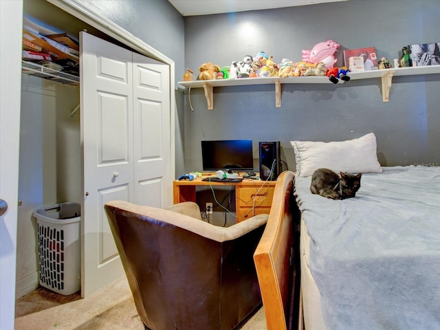 bedroom with light carpet and a closet