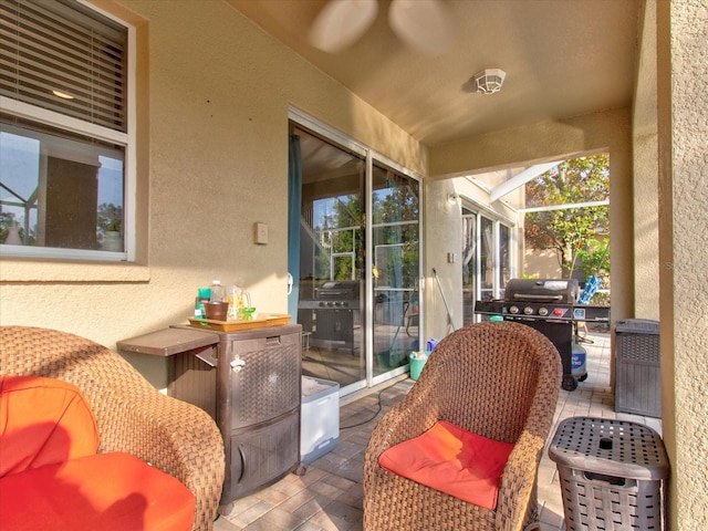 view of patio with a lanai and grilling area