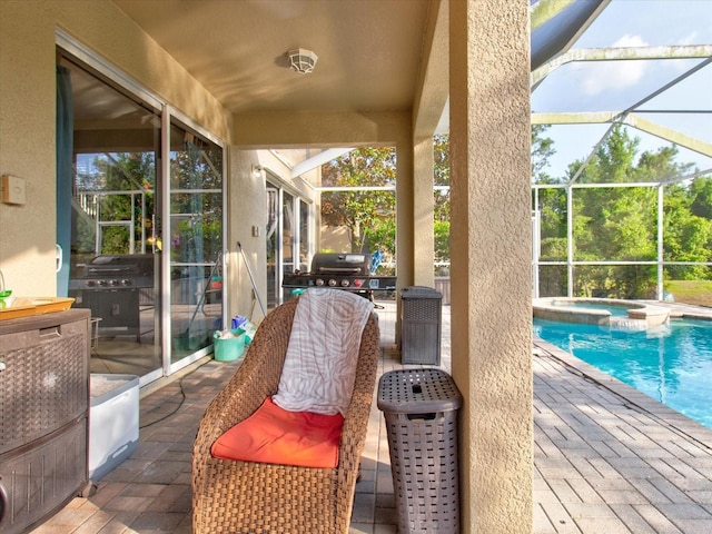 view of patio featuring a lanai, area for grilling, and a pool with hot tub