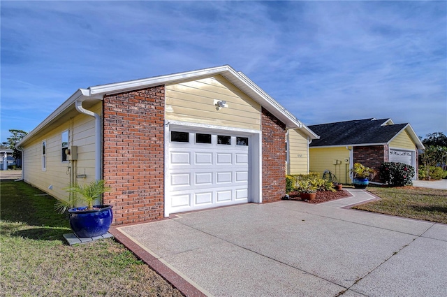 view of front of home with a garage and a front lawn