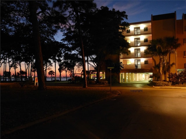 view of outdoor building at dusk